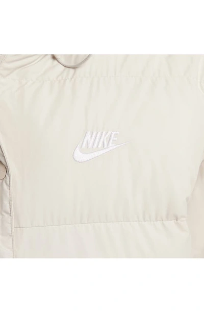Shop Nike Sportswear Water Repellent Down Coat In Light Orewood Brown/ White