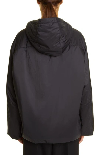 The Row Althena Padded Hooded Quarter-zip Track Jacket In Black
