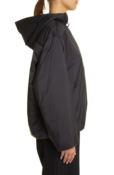 The Row Althena Padded Hooded Quarter-zip Track Jacket In Black