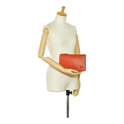 Shop Fendi Selleria Orange Leather Clutch Bag ()