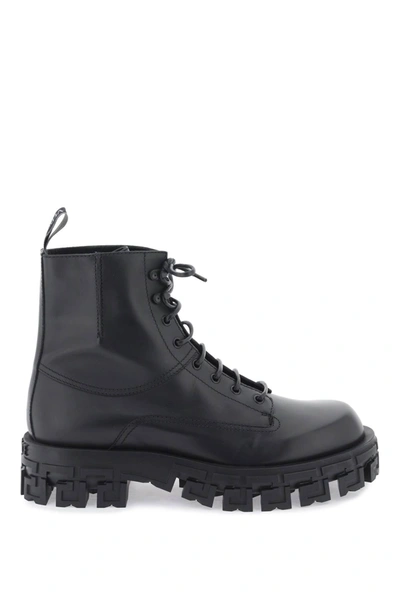 Shop Versace Greca Portico Combat Boots In Black