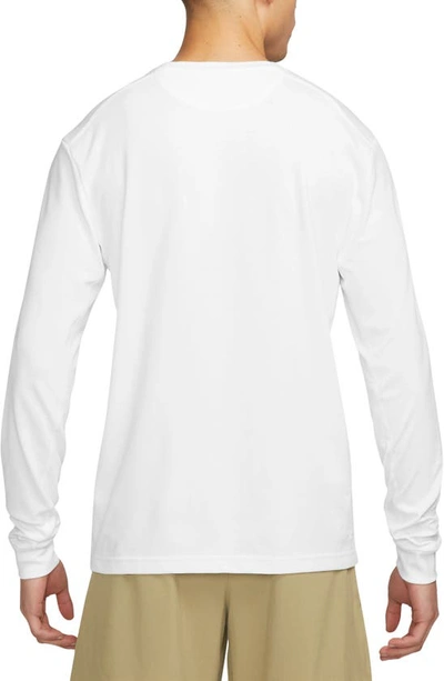Shop Nike Dri-fit Primary Long Sleeve T-shirt In White/ White