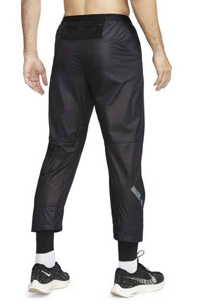 Shop Nike Running Division Storm-fit Phenom Water Resistant Pants In Black