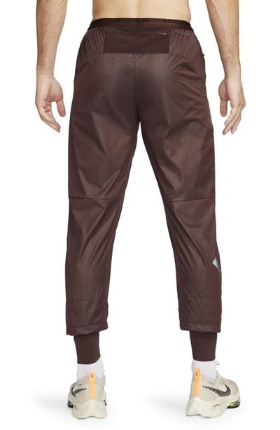 Shop Nike Running Division Storm-fit Phenom Water Resistant Pants In Earth