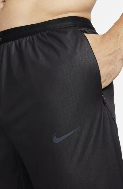 Shop Nike Running Division Storm-fit Phenom Water Resistant Pants In Black