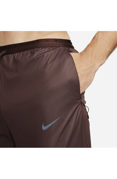 Shop Nike Running Division Storm-fit Phenom Water Resistant Pants In Earth