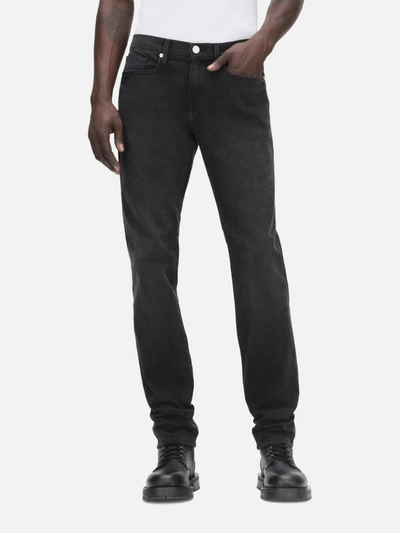 Frame Mid-rise Slim-fit Denim Trousers In Black