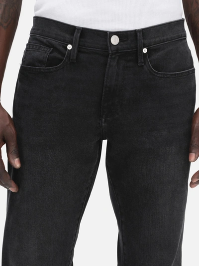 Frame Mid-rise Slim-fit Denim Trousers In Black