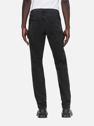 Frame Mid-rise Slim-fit Denim Trousers In Black