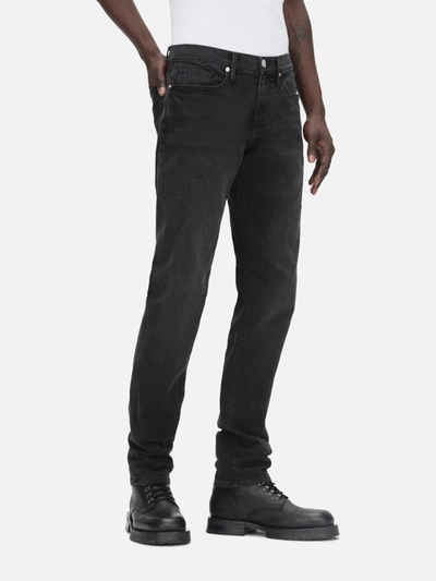 Frame Mid-rise Slim-fit Denim Trousers In Black