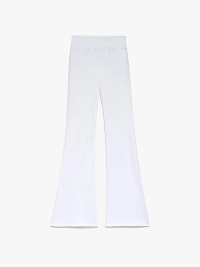 Shop Frame The Jetset Flare Jeans In White