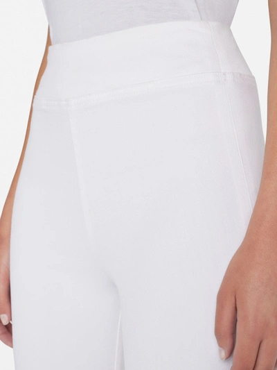 Shop Frame The Jetset Flare Jeans In White