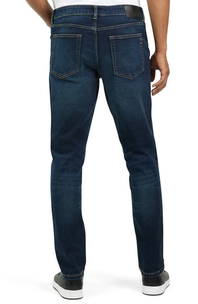 Shop Dkny Bedford Slim Jeans In Blue Mountain