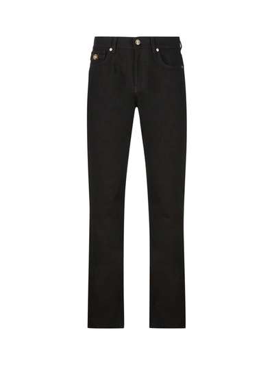 Shop Versace Trousers In Black