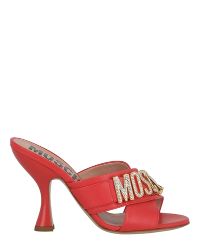 Shop Moschino Crystal Logo Leather Mules In Orange