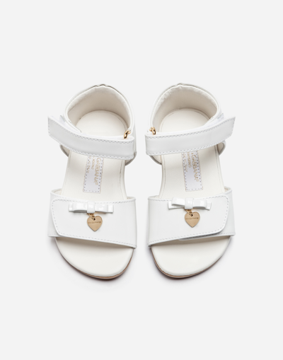 Shop Dolce & Gabbana First Steps Sandals In Patent Leather With Bow In White