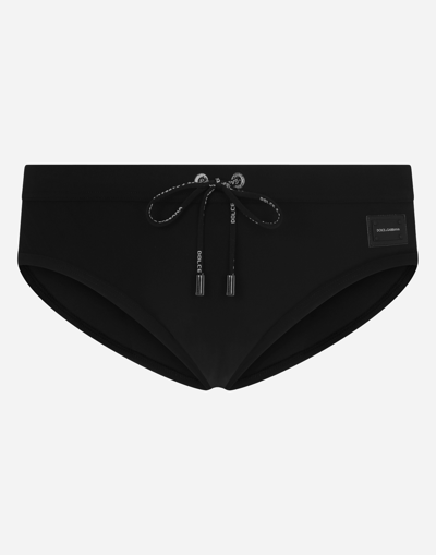 Shop Dolce & Gabbana Swim Briefs With High-cut Leg And Branded Metal Plate In Black