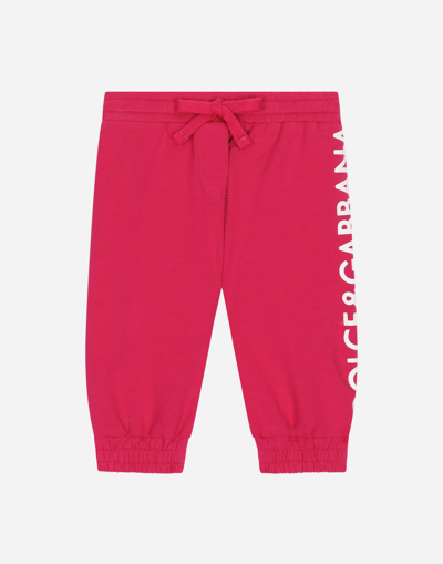 Shop Dolce & Gabbana Jersey Jogging Pants With Logo Print In Fuchsia