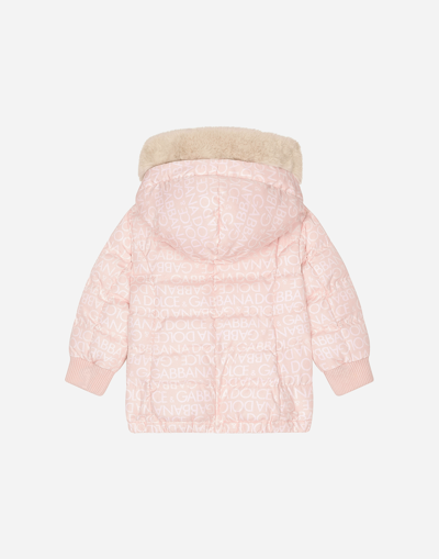 Shop Dolce & Gabbana Long Nylon Down Jacket With All-over Logo Print In Pink