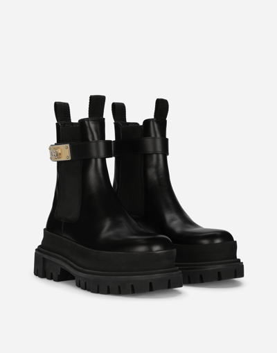 Dolce & Gabbana Calfskin Ankle Boots With Branded Strap In Schwarz