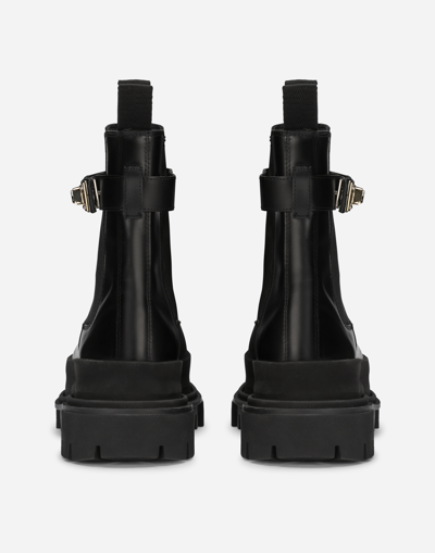 Dolce & Gabbana Calfskin Ankle Boots With Branded Strap In Schwarz