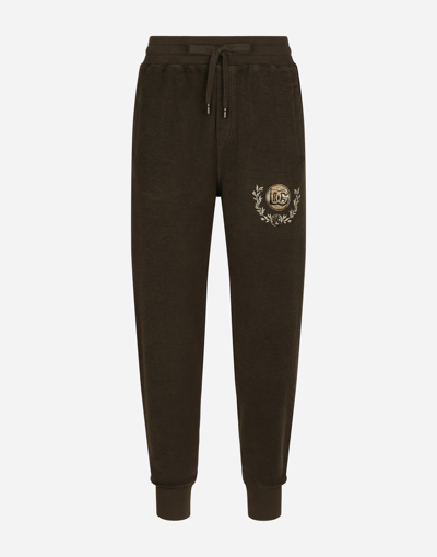 Shop Dolce & Gabbana Jersey Jogging Pants With Dg Coin Print In Brown