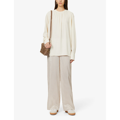Shop Totême Shirred Relaxed-fit Woven Blouse In Ivory 008