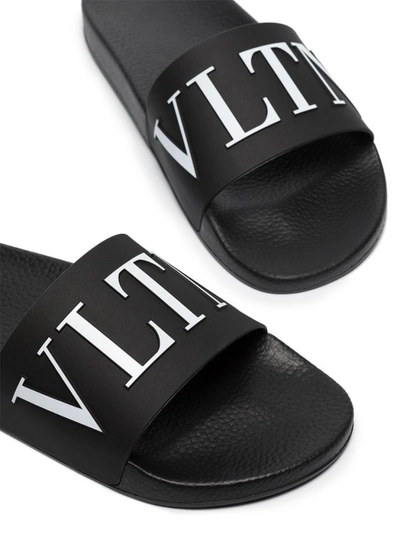 Shop Valentino Logo Print Sandals In Black