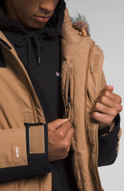 Shop The North Face Mcmurdo Waterproof 600 Fill Power Hooded Down Parka With Faux Fur Trim In Almond Butter/ Tnf Black