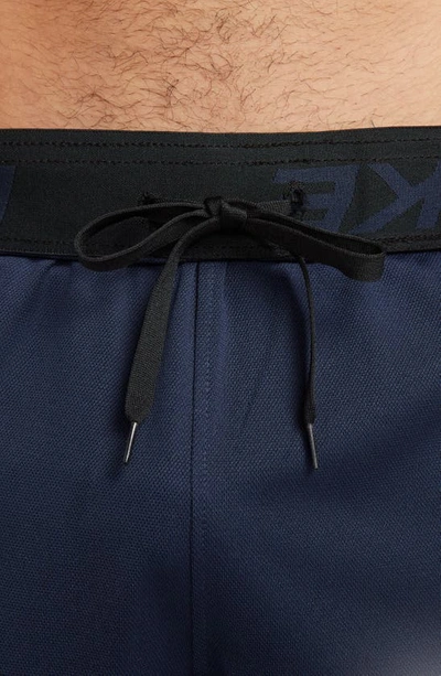 Shop Nike Dri-fit 7-inch Brief Lined Versatile Shorts In Obsidian/ Black