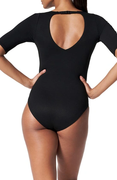 Shop Spanx Piqué Shaping Short Sleeve One-piece Rashguard Swimsuit In Very Black