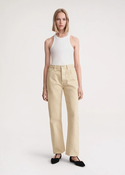 Shop Totême Twisted Seam Denim Full Length Washed Beige