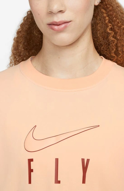 Shop Nike Dri-fit Swoosh Fly Graphic T-shirt In Ice Peach