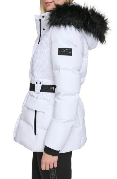 Shop Karl Lagerfeld Smocked Belted Ski Puffer Jacket With Faux Fur Hood In White