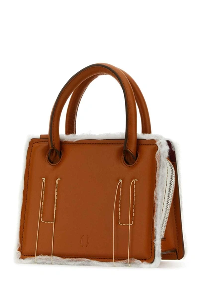 Shop Dentro Handbags. In Camel
