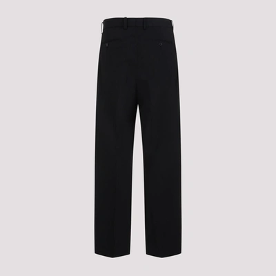 Shop Auralee Light Wool Max Gabardine Two-tuck Slacks Pants In Black