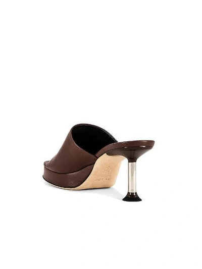 Shop By Far Cala Patent Leather Mules In Brown