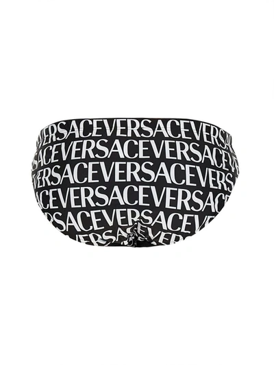 Shop Versace Beach Briefs With Allover Logo In Black