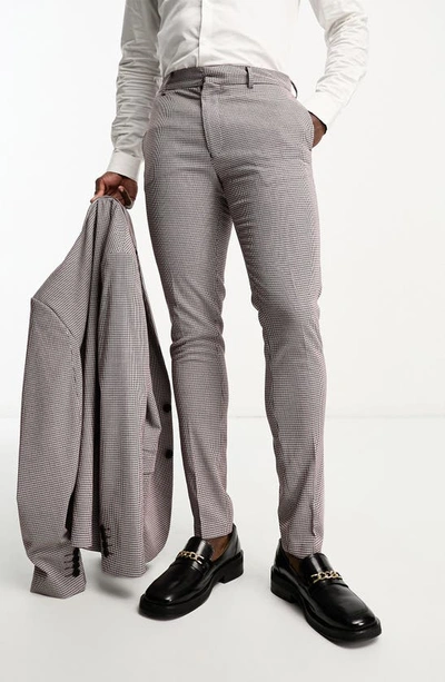 Shop Asos Design Skinny Flat Front Houndstooth Dress Pants In Burgundy