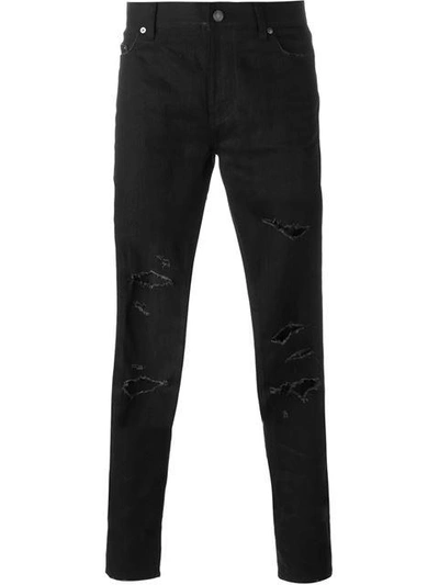 Shop Saint Laurent Skinny Ripped Jeans - Black