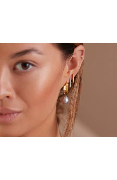 Shop Monica Vinader Groove Huggie Earrings In Gp