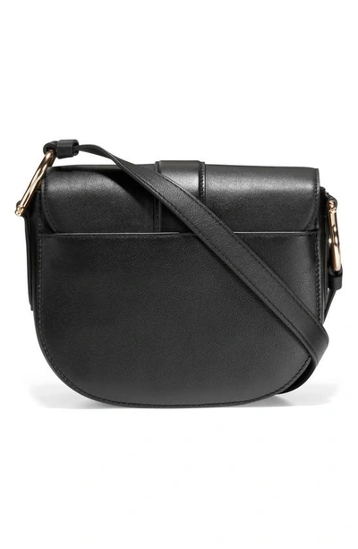 Shop Cole Haan Mini Essential Saddle Bag In Black