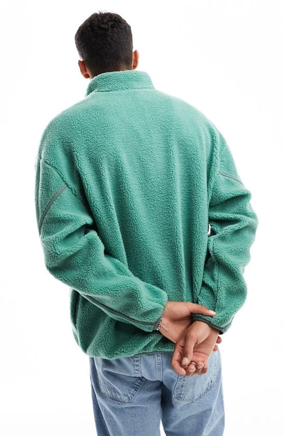 Shop Asos Design Borg Half Zip Fleece Sweatshirt In Mid Green