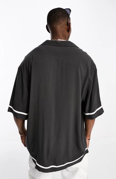 Shop Asos Design Tipped Longline Bowling Shirt In Black