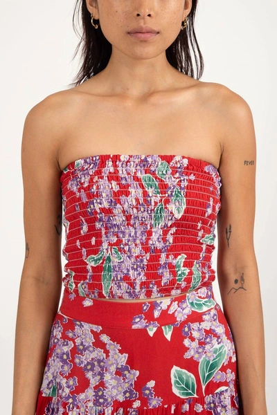 Shop Rhythm Isle Floral Smocked Strapless Top In Red