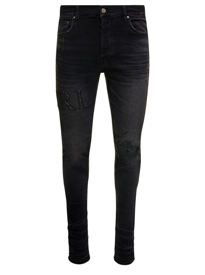 Shop Amiri Black Skinny Jeans With Crystal Embellished Logo And Used Effect In Stretch Cotton Denim Man