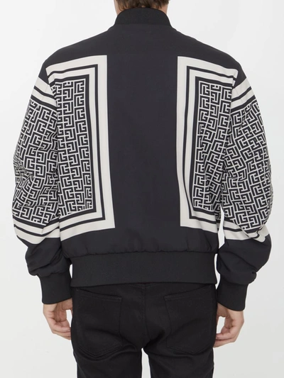 Shop Balmain Reversible Monogram Bomber Jacket In Black