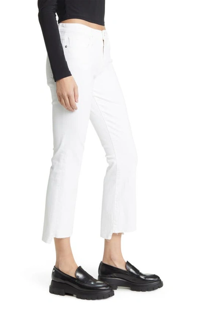 Shop Frame Le Crop Mini Boot Stagger Raw Hem Crop Bootcut Jeans In Blanc