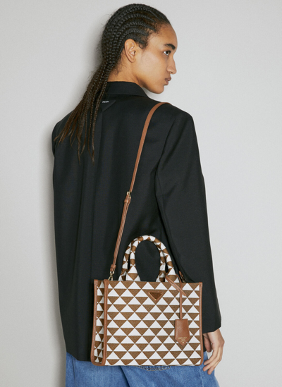 Shop Prada Small Symbole Embroidered Handbag In Brown