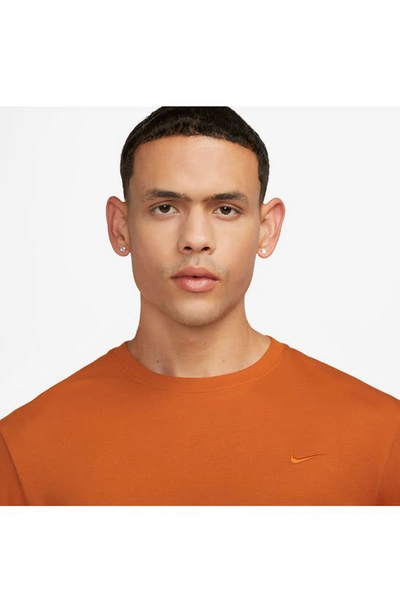 Shop Nike Dri-fit Primary Long Sleeve T-shirt In Campfire Orange
